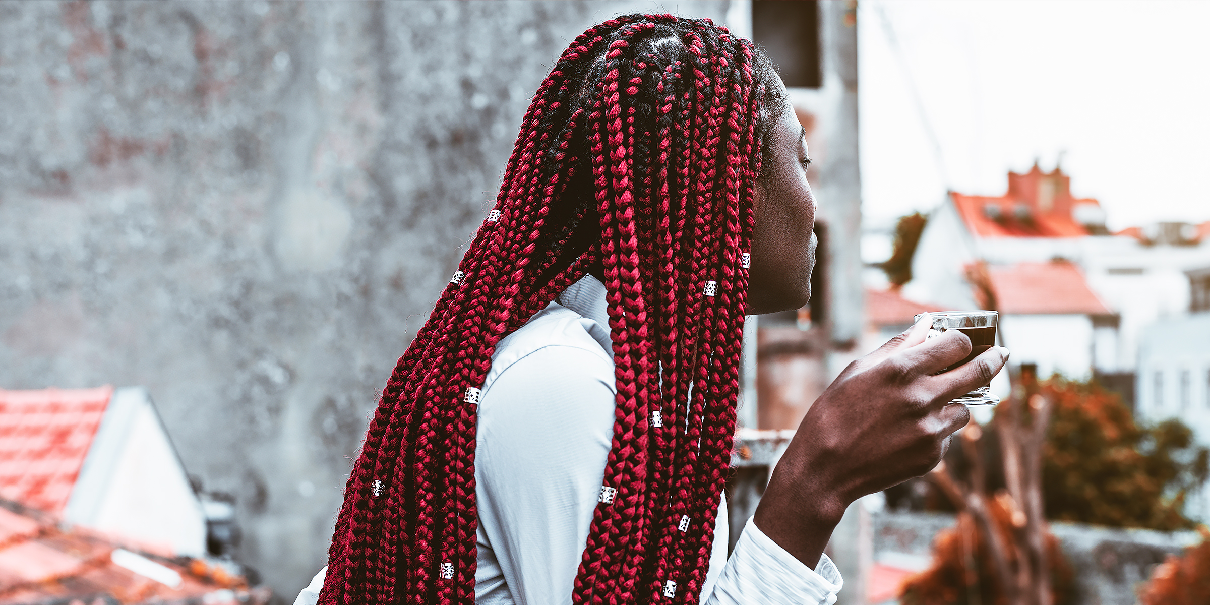 A woman with red box braids | Source: Shutterstock