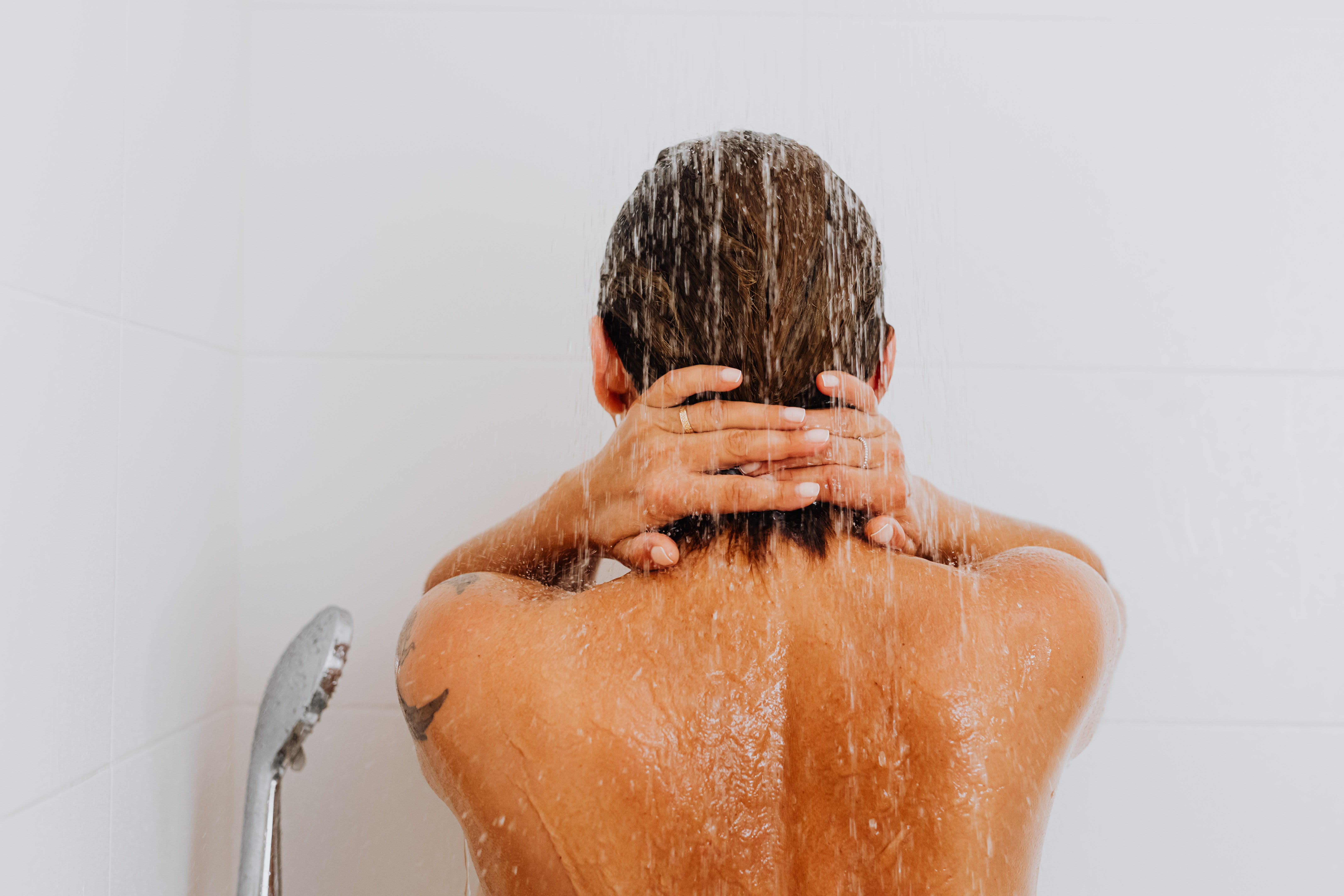 Hop into a hot shower to let that stubborn marshmallow melt away. | Source: Pexels