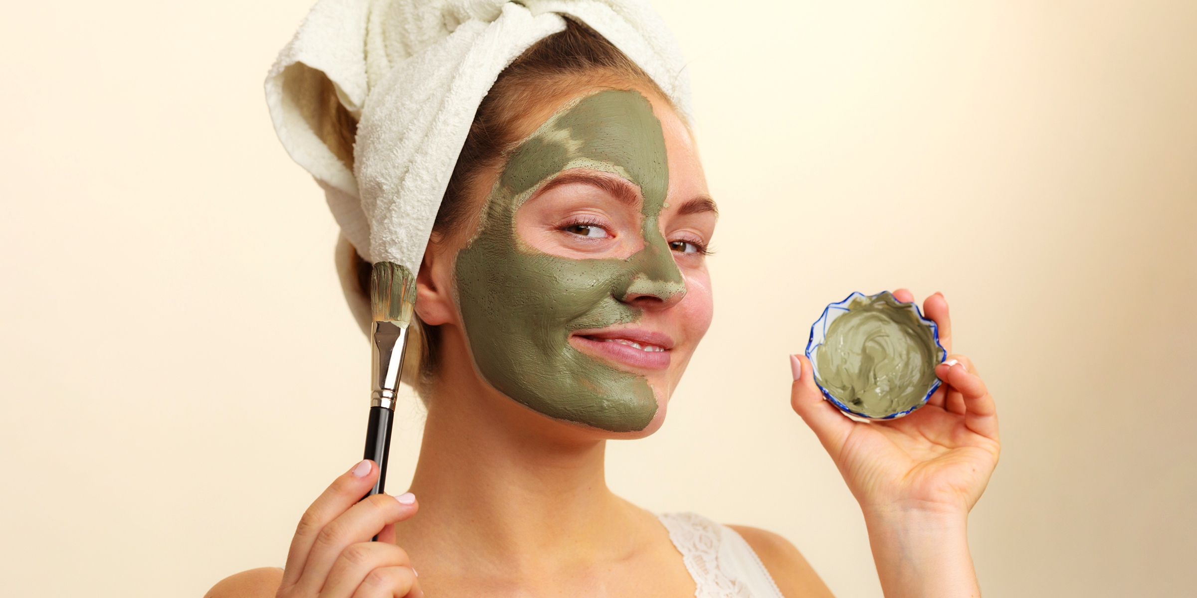 A woman engaging in her skincare routine | Source: Shutterstock